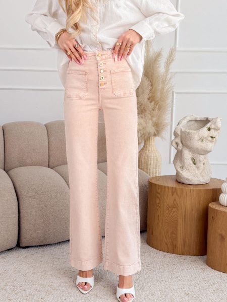 Spodnie jeansowe z ozdobnymi guzikami i kieszeniami Pudrowe – Buttonique 1